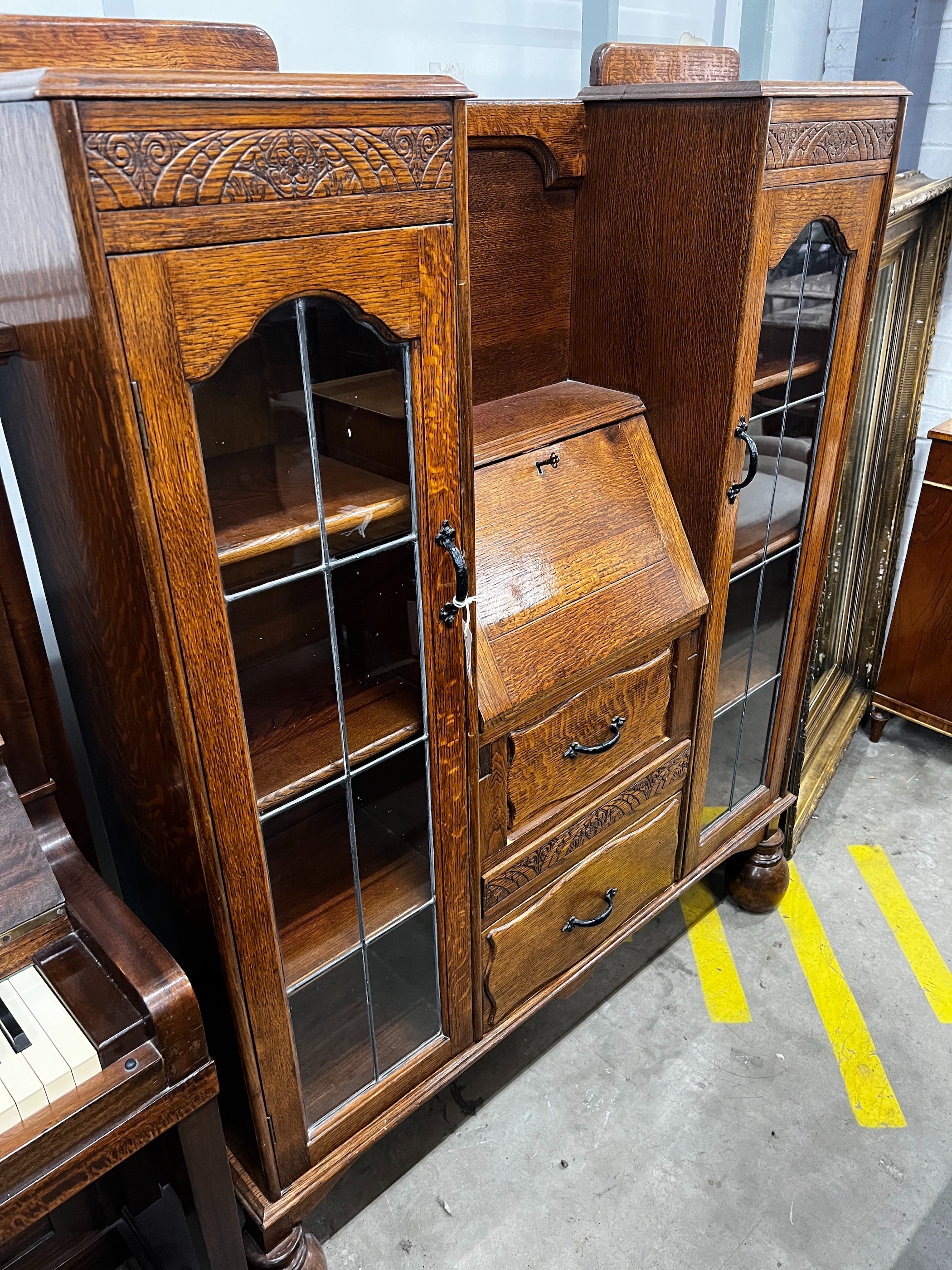 An early 20th century oak bureau bookcase, length 120cm, depth 28cm, height 154cm